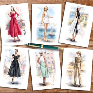 May include: A collection of six watercolor-style fashion illustrations featuring various outfits, including a red dress, a white romper, a black and white ensemble, a black dress, a mint skirt set, and a khaki safari suit, with a green fountain pen.
