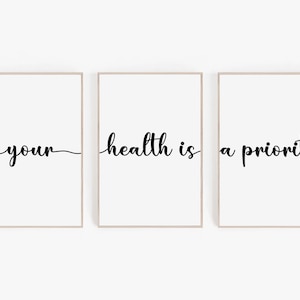 May include: Three framed prints with the text "your health is a priority" in black cursive font on a white background.