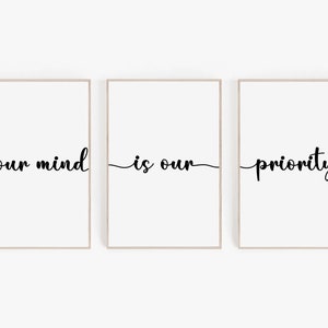 Può includere: Tre stampe incorniciate con il testo "your mind is our priority" in corsivo nero su sfondo bianco.