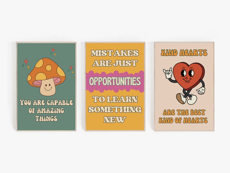 May include: Three retro-style motivational posters with colourful illustrations and text. The first poster features a smiling mushroom with the text "You are capable of amazing things". The second poster features a yellow background with the text "Mistakes are just opportunities to learn something new". The third poster features a pink background with a cartoon heart and the text "Kind hearts are the best kind of hearts".