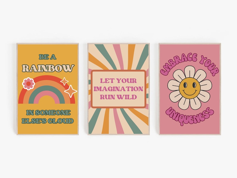 May include: Three retro-style motivational posters with colourful backgrounds and text. The first poster is yellow with a rainbow and the text "Be a Rainbow in Someone Else's Cloud". The second poster is orange and green with the text "Let Your Imagination Run Wild". The third poster is pink with a flower and the text "Embrace Your Uniqueness".