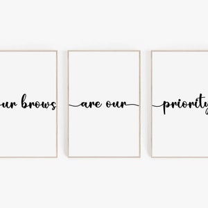 May include: Three framed prints with the text "your brows are our priority" in black cursive font on a white background.