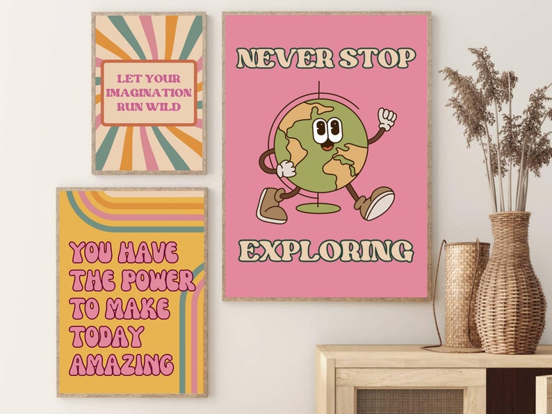 May include: Three retro-style motivational posters with colourful stripes and pink text. The first poster says "Let your imagination run wild". The second poster says "You have the power to make today amazing". The third poster says "Never stop exploring" and features a cartoon globe with legs and arms.