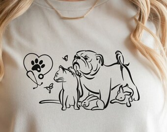 May include: A white t-shirt with a black graphic of a bulldog, cat, and rabbit. The graphic includes a heart with a paw print inside and butterflies.