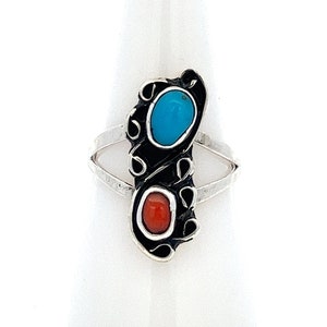 May include: A silver ring with a turquoise and coral stone design. The ring is set on a white background.