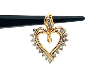 May include: A gold heart-shaped pendant with a diamond-encrusted border. The pendant features a delicate, intertwined heart design.