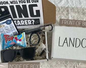 Caja de regalo personalizada para la propuesta de matrimonio del portador de anillos: gafas de sol, pulsera y llavero.