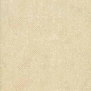 May include: A close-up of a fabric with a light beige background. The fabric has a pattern of small, irregular dots in a lighter beige color, creating a subtle, textured effect. The overall appearance is soft and muted.