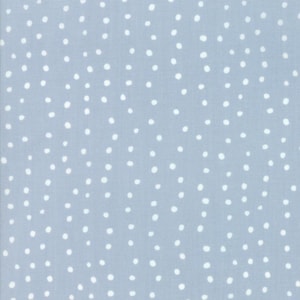 May include: A light blue fabric with a white polka dot pattern.