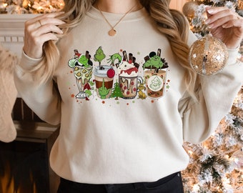 Sudadera navideña del Grinch: diseño navideño de cacao, un atuendo acogedor para el invierno.