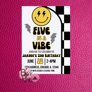 May include: A white invitation card with a yellow smiley face, lightning bolts, and the text "FIVE IS A VIBE." It announces Jakobe's 2nd birthday, with date, time, address, and RSVP information. The background is a textured pink surface.