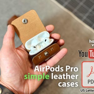 May include: A tan and brown leather AirPods Pro case, open to reveal white earbuds. The case features a snap closure and decorative stitching. The image includes text that reads "AirPods Pro simple leather cases" and "YouTube".