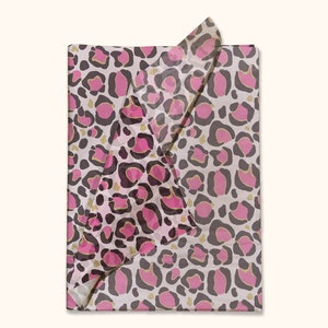 May include: Pink and brown leopard print tissue paper with gold glitter accents.