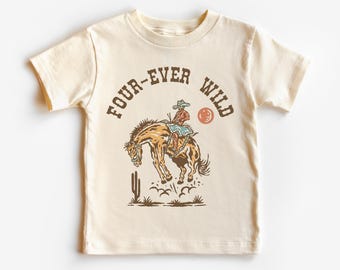 May include: A beige t-shirt with a graphic of a cowboy riding a bucking horse. The text "FOUR-EVER WILD" is printed on the shirt.