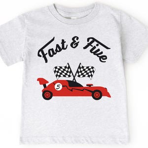 May include: Gray t-shirt with a red race car and checkered flags. The text "Fast & Five" is printed on the shirt.