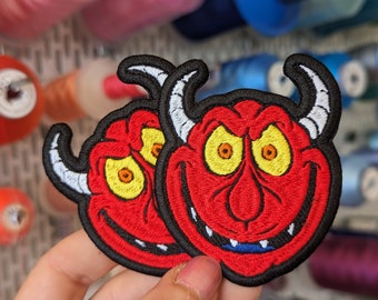 Red demon embroidered patch. Iron-on or sew-on. Custom design. 7.5 cm.