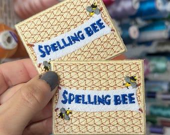 Spelling Bee embroidered patch. To sew or iron on. Own design. Price per unit. 7cm.