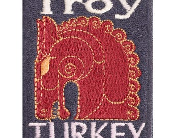 Troy embroidered patch, a souvenir from a trip to Türkiye. Sew-on or iron-on. 7cm x 5.5cm.