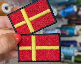 Embroidered patch "Flag of Skåne, SWEDEN".  to sew or iron. price by unit. Own. 6cm x 4cm.