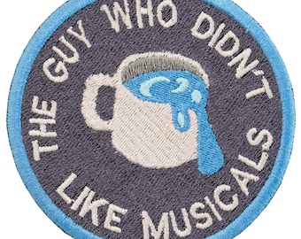 Musical embroidered patch "The Guy Who Didn't Like Musicals." 8cm. Custom design. Sew or iron on.