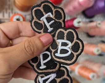 Initial paw print embroidered patch with pet name. Sew-on or iron-on.