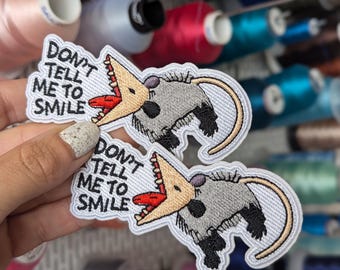 "Don't tell me to smile" embroidered patch. Iron-on or sew-on. 10cm.