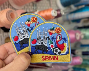 "Trip to Spain" embroidered patch. To sew or iron on. Price per unit. 6cm x 6'5cm.