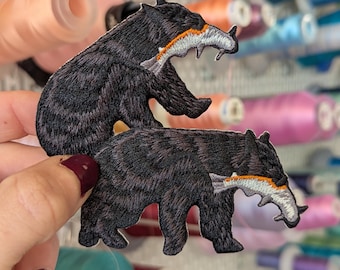 Embroidered patch Bear with salmon. 8cm. Own design. To sew or iron. Price per unit.