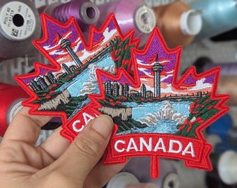 Embroidered patch, souvenir of a trip to Canada. Sew or iron on. 10cm.