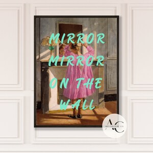 May include: A vintage-style painting of a young girl in a pink dress standing in front of a mirror. The text "MIRROR MIRROR ON THE WALL" is written in turquoise letters on the painting.