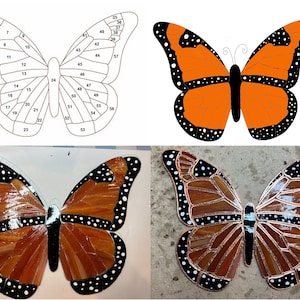 Könnte beinhalten: Ein Schmetterling aus Buntglas mit orangefarbenen und schwarzen Flügeln. Der Schmetterling besteht aus 57 einzelnen Glasscheiben. Das Glas wird in verschiedene Formen und Größen geschnitten und dann zu dem Schmetterling zusammengefügt.