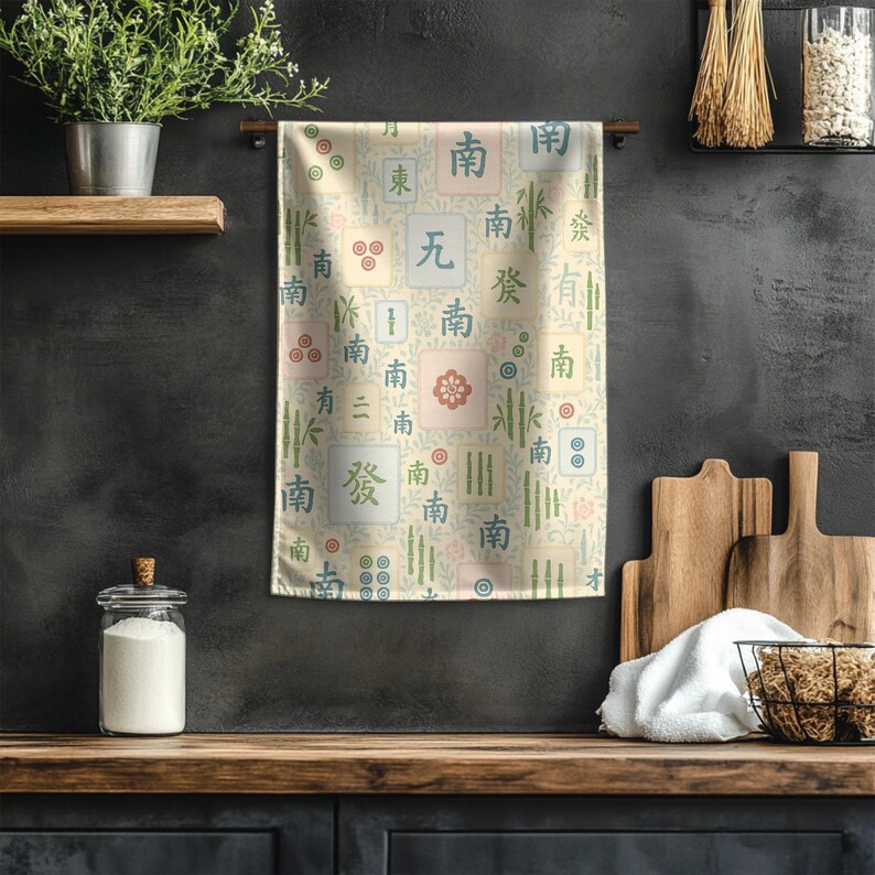 Elegant Mahjong pattern tea towel hanging beside cutting boards and herbs