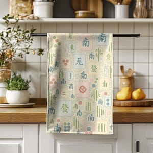 Pastel Mahjong design tea towel displayed in a bright modern kitchen setting