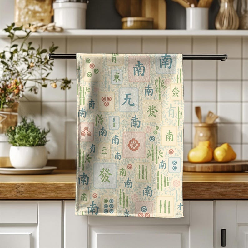 Pastel Mahjong design tea towel displayed in a bright modern kitchen setting