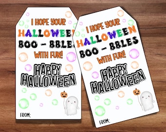 May include: Two white gift tags with a ghost holding a pumpkin and the text "I hope your Halloween Boo-Bbles with fun! Happy Halloween" and "From:"