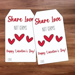 Puede incluir: Dos etiquetas de regalo blancas con corazones rojos y el texto "Comparte el amor, no los gérmenes" y "¡Feliz Día de San Valentín!"  AMOR.
