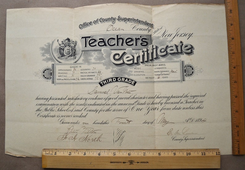 May include: A black and white teacher's certificate from Ocean County, New Jersey, dated May 1, 1894, for Samuel Van Tote, for the Third Grade. The certificate states that he has presented satisfactory evidence of good moral character and passed the required examination.