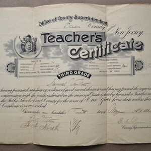May include: A black and white teacher's certificate from Ocean County, New Jersey, dated May 4, 1894, for Samuel Van Note, Third Grade.