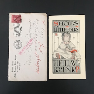 May include: A vintage envelope postmarked 1909 with handwritten address and a promotional card featuring an illustration of a child and the text SHOES FOR LITTLE FOLKS FIFTH AVE BOOT SHOP. The envelope includes Frank Bros. Fifth Avenue Boot Shop text.