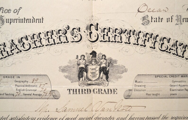 May include: A black and white image of a teacher's certificate from the State of New Hampshire. The certificate is for the Third Grade and is dated 1877. The certificate includes the name of the teacher, Samuel Vanhote, and the grades received in various subjects.