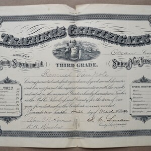 May include: A black and white teacher's certificate from Ocean County, New Jersey, dated March 1, 1890. The certificate is for Samuel Vau Note, who has been licensed to teach in the public schools of the county for one year. The certificate lists the grades received in various subjects, including orthography, reading, writing, geography, practical arithmetic, English grammar, and general average.
