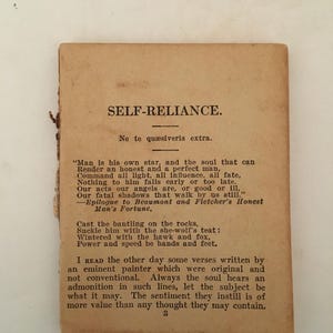 May include: A vintage, aged paper with the title "SELF-RELIANCE" printed in black. The text includes a quote about self-reliance and a poem. The paper has a worn, antique appearance, with visible aging and slight damage to the edges.