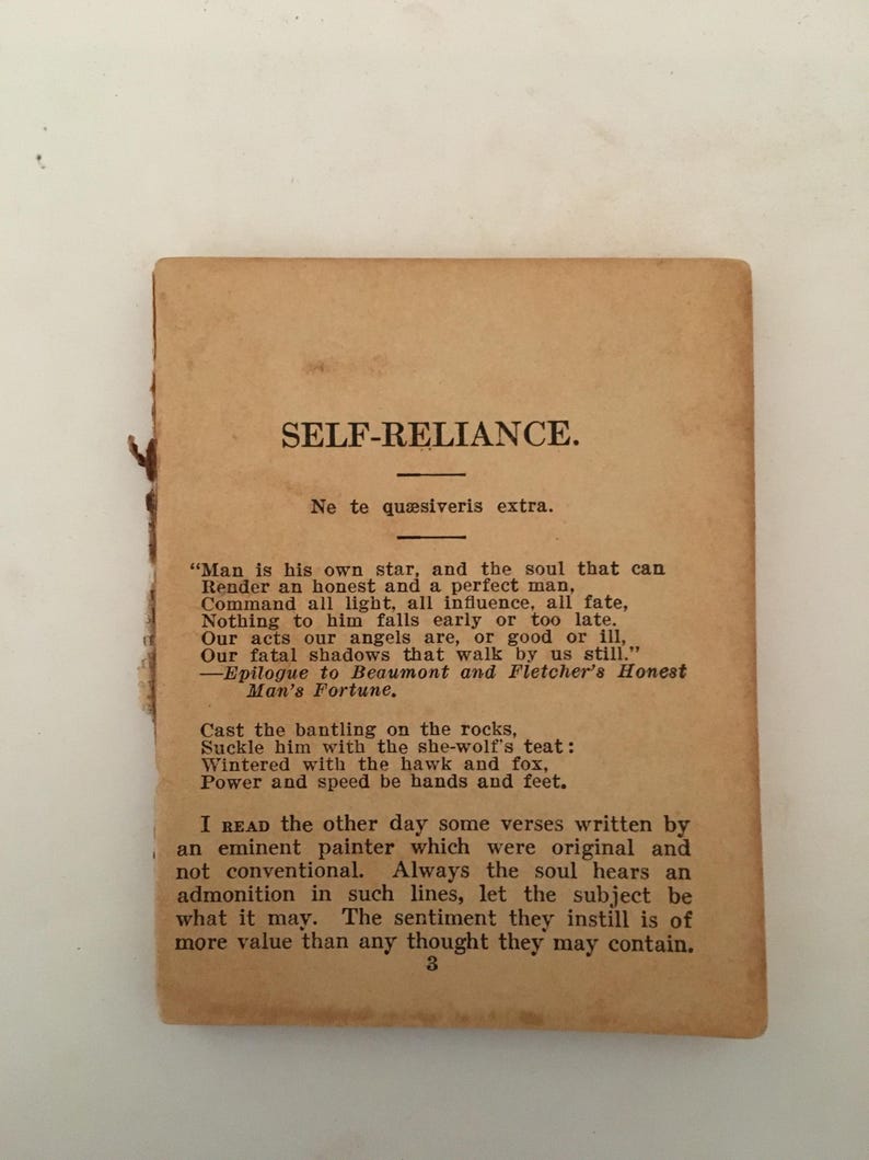 May include: A vintage, aged paper with the title "SELF-RELIANCE" printed in black. The text includes a quote about self-reliance and a poem. The paper has a worn, antique appearance, with visible aging and slight damage to the edges.
