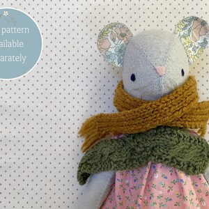 Handmade mouse doll wearing handknit scarves.