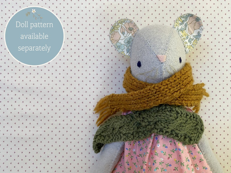 Handmade mouse doll wearing handknit scarves.