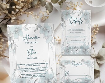 May include: A wedding invitation suite with a floral design in shades of blue and gray. The invitation features the names "Alexandra Toussaint" and "Ethan Wingate" and details the wedding date, time, and location. The RSVP card includes a floral design and the text "Response".