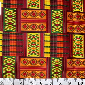 May include: A close-up of a colourful fabric with a geometric pattern in shades of red, orange, yellow, and green. The fabric has a repeating pattern of squares and diamonds. The fabric is measured with a ruler, showing that it is 60 inches wide.
