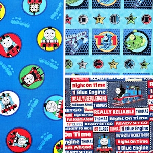 May include: Blue and red fabric with a repeating pattern of Thomas the Tank Engine. The fabric has the text "Ready Set Go" and "Right On Time" with a blue engine graphic.