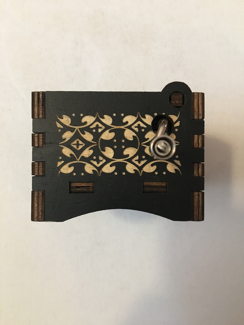 Hand crank music box with wood engraving