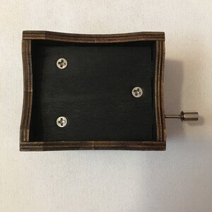 Hand crank music box with wood engraving